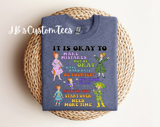 It is okay to… - Ms. Frizzle Gildan Crewneck